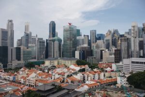 houses near high-rise buildings during daytime